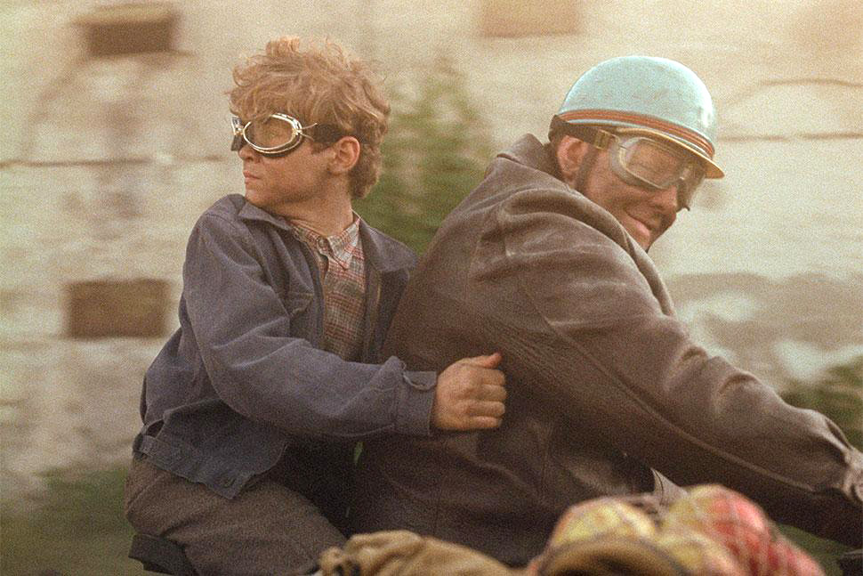 Bojtorján Barábas (left) and Grégory Gadebois on a motorbike in "Orphan" directed by László Nemes
