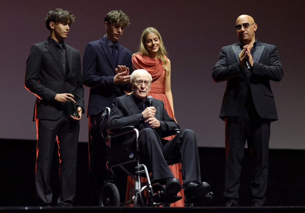Vin Diesel (right) presents a Honoree Award to Michael Caine (center) onstage during the Opening Ceremony at the Red Sea International Film Festival 2025 on December 04, 2025 in Jeddah, Saudi Arabia