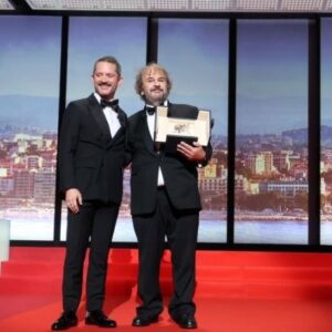 Sir Peter Jackson, film director, receives honorary Palme d'Or from Elijah Wood during the opening ceremony of the 79th international film festival, Cannes. Photo credit Manon Boyer-FDC
