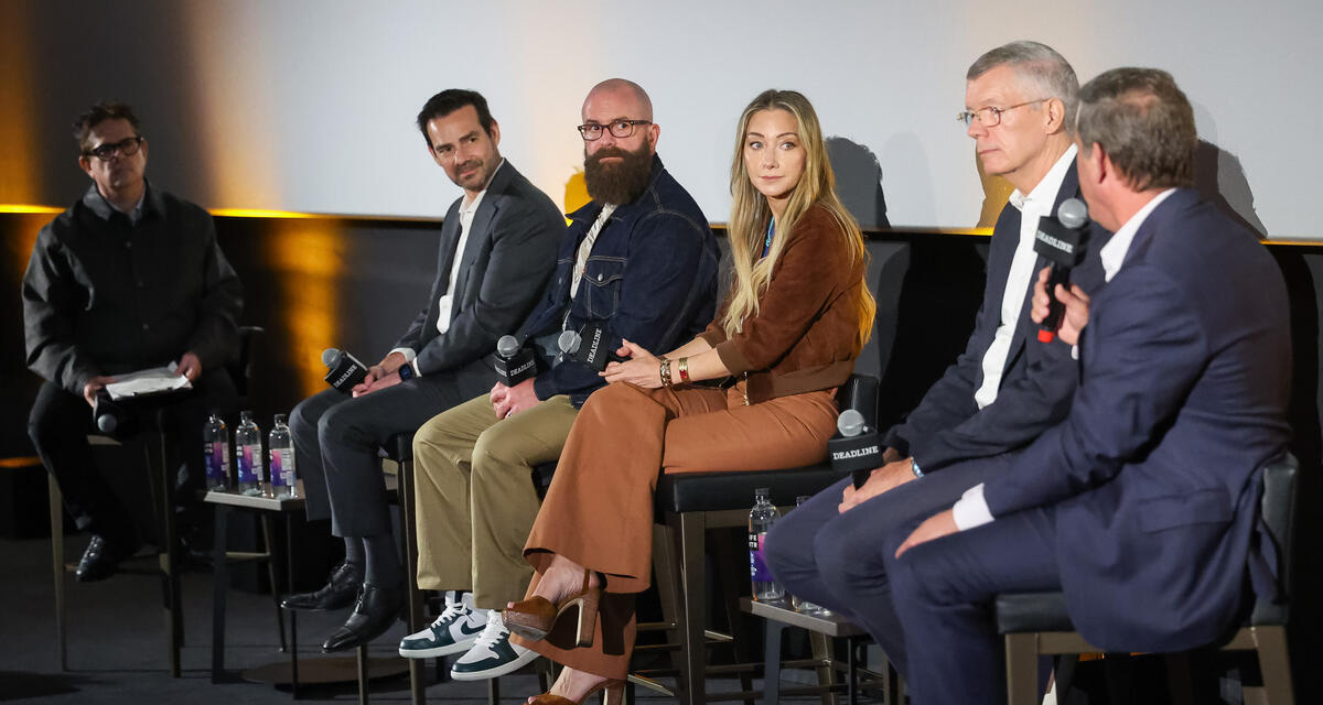 (From left) Anthony D'alessandro of Deadline, , Eduardo Acuna of Regal, filmmaker Michael Tiddes, Blair Rich of Legendary Entertainment, Andrew Cripps of Disney and Adam Fogelson of Lionsgate during the "Future of Storytelling for the Big Screen" panel at the Regal Sherman Oaks Galleria on June 15, 2026.