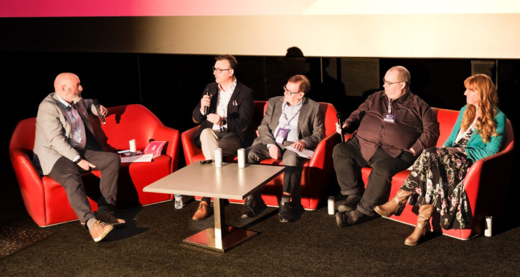 (From left) Phil Clapp from UK Cinema Association, Ben Hammond from Ashford Cinema, Geoff Greaves of Merlin Cinemas, Graeme Howell of Mareel, and Sarah Hulls of Magic Lantern Cinema, who participated in the "Audience Development - Lessons From the Coalface" panel at the UK Cinema Association conference on May 12, 2026 (Photo: Julie Edwards Visuals)