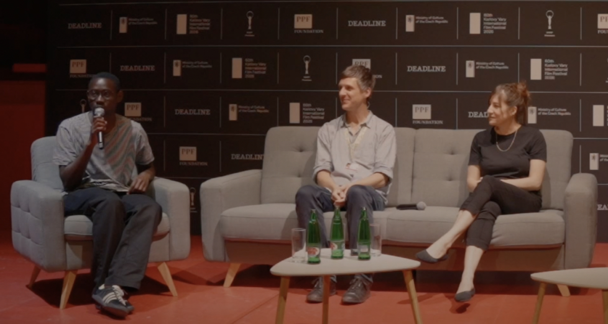 (From left) Moderator Zac Ntim of Deadline, Oscar-winning producer Mollye Asher ("Nomadland," "The Rider," "On Swift Horses") and film marketing strategist Mathias Noschis of Alphapanda participate in the "Audience First: Rethinking Film Marketing Before Distribution" panel at the Karlovy Vary IFF on July 6, 2026.