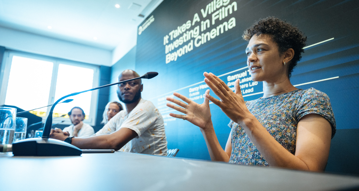 (From left) Locarno's Mitchell Harper moderated the "It Takes A Village: Investing in Film Beyond Cinema" panel, which featured Darcy Heusel, of Outside Pictures; Nicola Ofoego of Black Mic Mag, Logical Pictures; and Samuel Tebandeke of Kiasi. The panel took place on August 8, 2026, as part of the Swiss film festival's industry platform. (Photo: courtesy of Locarno Film Festival/Ti-Press)