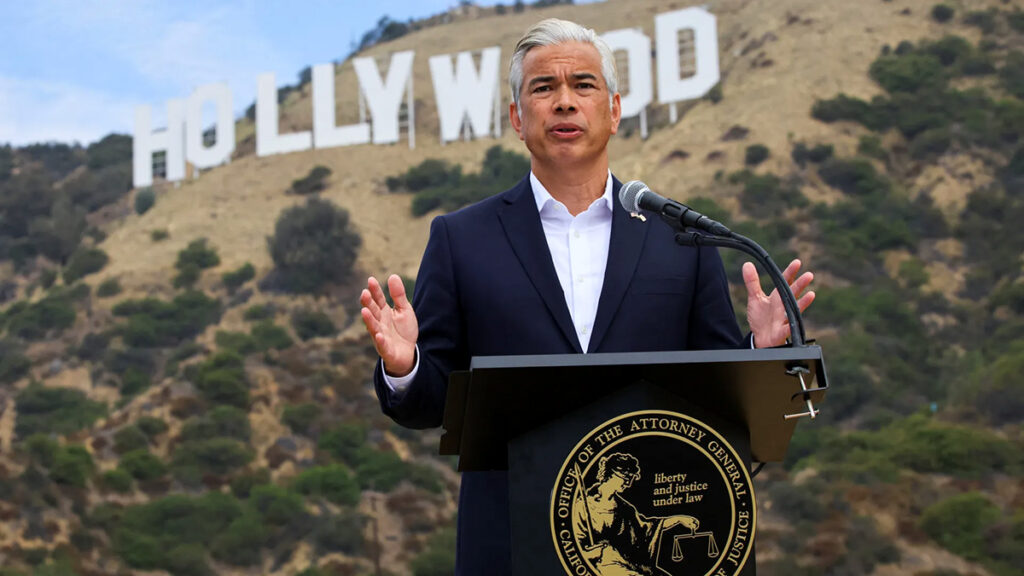California Attorney General Rob Bonta in front of the Hollywood sign, in Los Angeles, California, announcing a lawsuit by 12 state's attorneys general to block the merger between Paramount Skydance and Warner Bros. Discovery. 