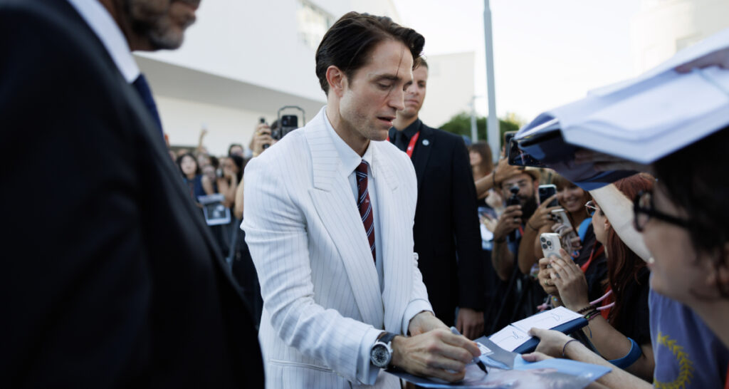 Robert Pattinson greets fans while he's in Venice for the premiere of A24's "Primetime", a drama about Chris Hansen's "To Catch a Predator" sting show. (Photo: Courtesy Archivio Storico La Biennale di Venezia)