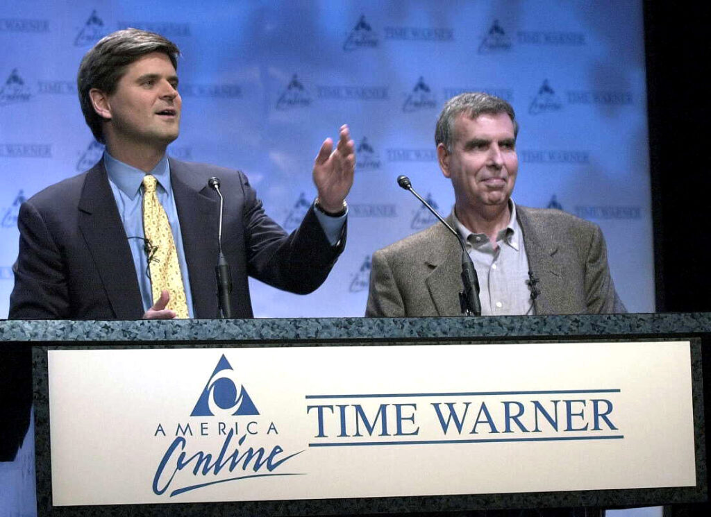 (From Left) Steve Case, then the Chairman of America Online with and then Time Warner Chairman Gerald Levin as they announced their corporate merger in New York on January 10, 2000.